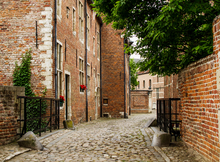 Old belgian street with brick house in Groot Begijnhof Leuven, Belgiumの写真素材