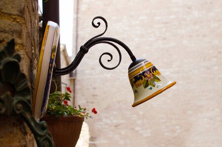 Ceramic street lamp in medieval street of Spello, Italyの写真素材