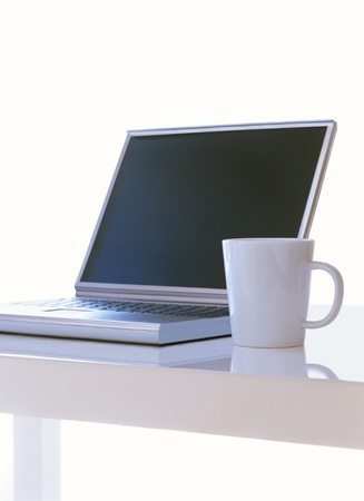 computer and mug cupの写真素材