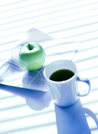 newspaper and appleの写真素材