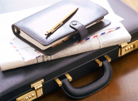 attache case and newspaperの写真素材