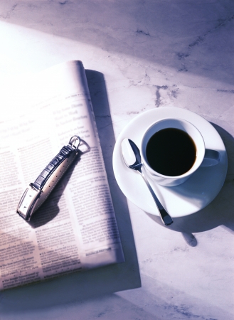 newspaper and  wrist watchの写真素材