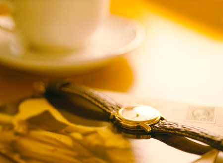 wrist watch and coffee cupの写真素材