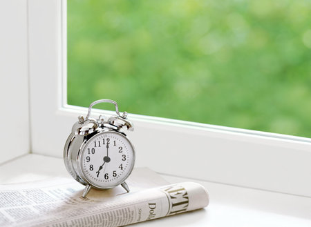 alarm clock and newspaper