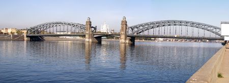 Big Ohta bridge (Peter The Great bridge) through Neva river in St. Petersburg, Russia (1909) with Smolny orthodox Churchの写真素材