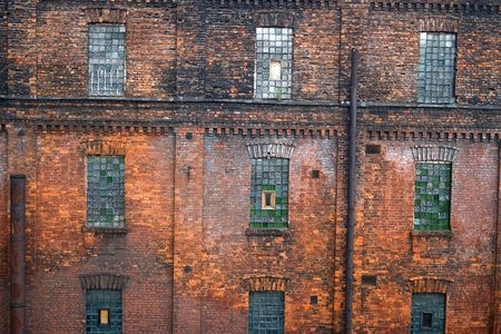 Red brick wall with mosaic windows. Old factory in Saint Petersburg ('Red Triangle')の写真素材