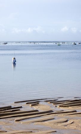 Fishermen in the morning, ocean coast, Bali, Indonesia (3)の写真素材
