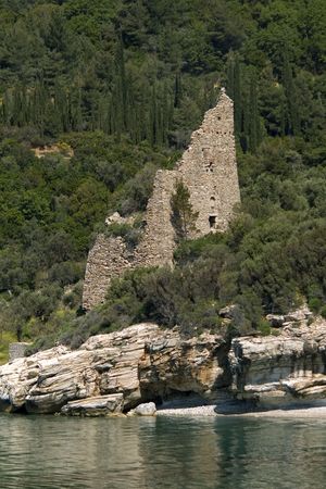 Old destroyed Venetian sentry serf tower on the coast, Athos, Greeceの写真素材