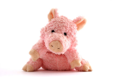 pink stuffed piglet isolated against white backgroundの写真素材