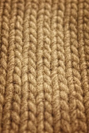 gray background of hand-knitted wool scarfの写真素材