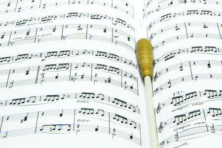 Baton on music score close upの写真素材