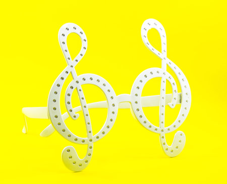 G clef glasses pattern on yellow background