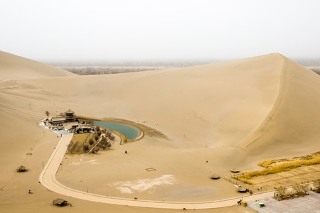 Mingsha shan desert and Crescent moon lake in Dunhuang, Gansu, Chinaの写真素材
