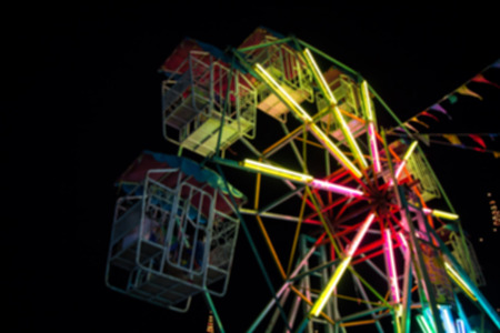 Blur ferris wheel background at nightの写真素材