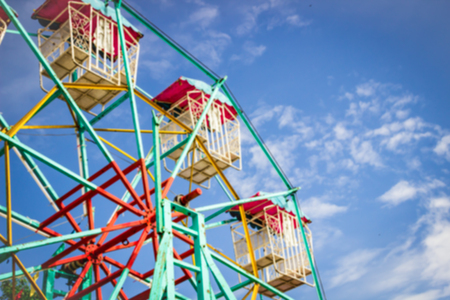 Blur ferris wheel on cloudy dayの写真素材