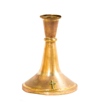 The old brass candlestick with the cross on white backgroundの写真素材