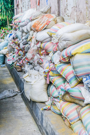 Sandbags pile to protect floodの写真素材