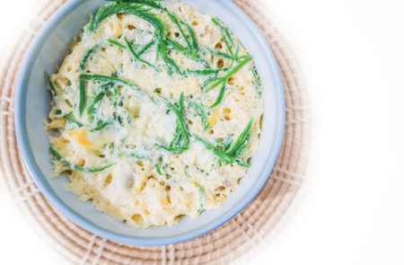 Steamed eggs with acacia pennata on white backgroundの写真素材