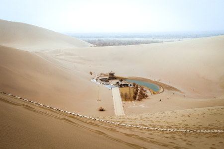 Mingsha shan desert and Crescent moon lake in Dunhuang, silk road in Gansu, Chinaの写真素材