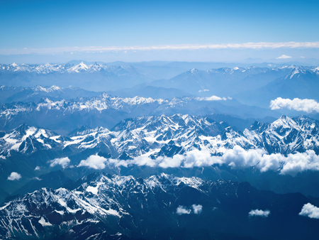 Clouds and snow over the mountains view from the airplane, Leh, Ladakh, Indiaの写真素材
