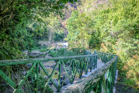 Green wood bridge at Jokkradin waterfall, Thong Pha Phum National Park, Kanchanaburi, Thailandの写真素材