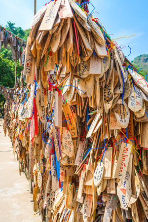 KANCHANABURI PROVINCE, THAILAND - APRIL 16, 2019:  The tourist wood sign who visited Ban E-Tong, Kanchanaburi, Thailand.のeditorial素材