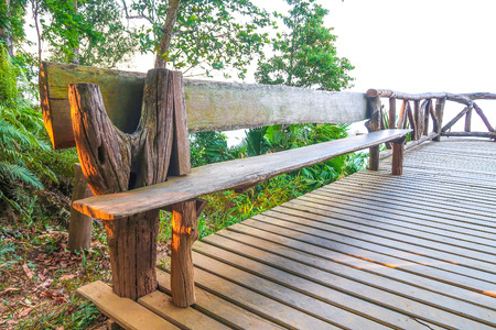 Wooden bench on the balcony in the parkの写真素材