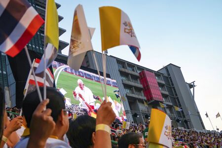 BANGKOK THAILAND, 21 NOVEMBER 2019: People watching Pope Francis in monitor during visit Thailand, Suphachalasai Stadium, Bangkok, Thailand,のeditorial素材