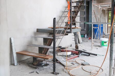 Wood top on metal stairs under constructionの写真素材