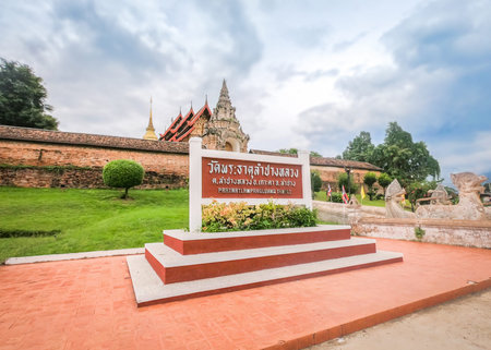 28 September 2020, Lampang, Thailand: Thai language sign name of Wat Phra That Lampang Luang, Lanna style temple at Lampang Province, Thailand.のeditorial素材