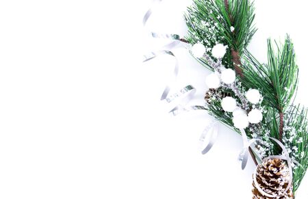 Christmas background, fir branch with pine cone on a white background. Creative christmas composition flatlay. New year, holiday, christmas, flat lay, top view.の写真素材