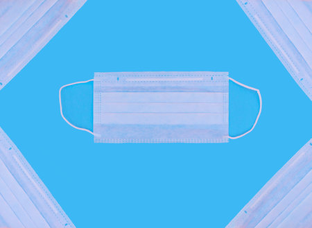 Medical masks on a blue background to prevent the spread of the virus, coronavirus, flu, colds, top...