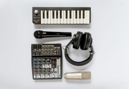 Black and white flat lay composition. Portable and compact music home studio for music production....