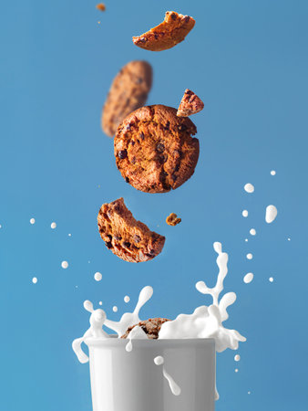Glass of milk and splash. With cookies levitation. Milk and cookies. food photoの写真素材