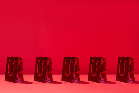 Sale, shopping concept, red paper shopping bags red background. Copy space for your text, templateの写真素材