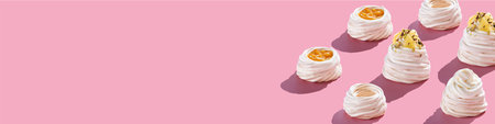 Dessert Anna Pavlova banner pink background. Copy space free place for your text. Pastry chef...