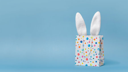 Easter sale, shopping, gift. Easter bunnys ears in a shopping bag, nice funny photo copy space for...