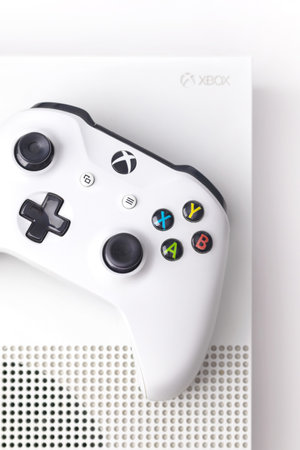 Vertical photo of Xbox One S Console and Controller on a white background close upのeditorial素材