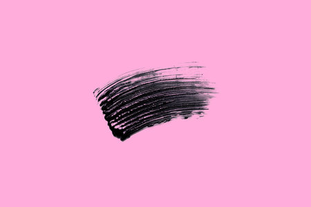 Swatch, beautiful graphic mascara brushstroke smear isolated on pink background flat layの写真素材