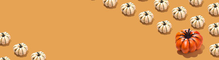 Long Horizontal banner with orange and white pumpkin pattern on orange background. Halloween concept copy space placeの写真素材