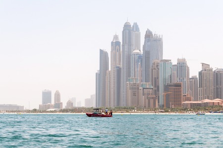 DUBAI, UAE - MAY 5,2017: Beautiful panoramic view of Dubai Marina beach with skyscrapers in the background in Dubai, UAEのeditorial素材