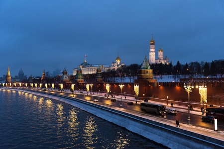 The Moscow Kremlin in the winter night and the Moskva River embankment with a Christmas decoration.の写真素材