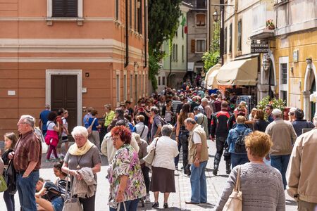 Limone sul Garda, Italy - April 30,2018: Picturesque view of Limone sul Garda, Lake Garda, Italy. Beautiful spring day. Central street with tourists, cafes and shopsのeditorial素材
