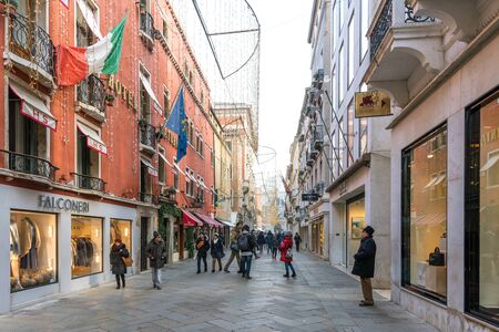Venice, Italy - December 29, 2018: Beautiful and pedestrian street Calle Larga XXII Marzo in winter with Christmas decorations.のeditorial素材