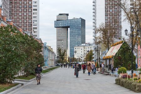 Moscow, Russia - October, 5 2019: Shkolnaya street during the festival Golden Autumn in Moscow. Shkolnaya street in the center of Moscow after reconstruction. Old houses with modern residential houses at the backgroundのeditorial素材