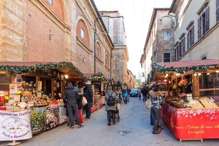 Montepulciano, Italy -January 3, 2019: Christmas Market in Montepulciano. Tourists in the Christmas market. Historical centre with Christmas decorations in Montepulcianoのeditorial素材