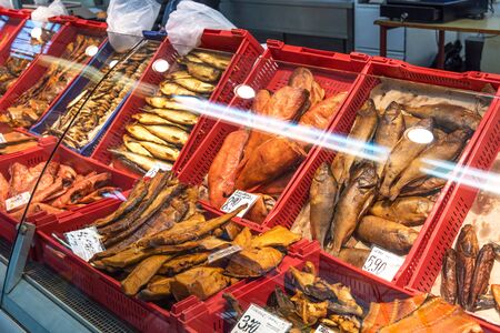 Riga, Latvia - October 28, 2019: Fresh fish at Riga Central Market. Smoked and salted fish at the Fish market in Riga, Latvia.のeditorial素材