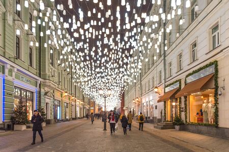 MOSCOW, RUSSIA - DECEMBER 25, 2019: New Year and Christmas decoration of the Stoleshnikov Lane. Pedestrian short street with boutiques and luxury shops in Moscow, Russia.のeditorial素材