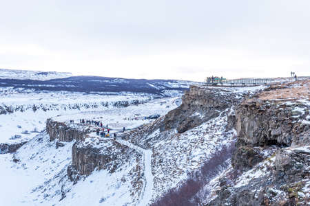 GULLFOSS, ICELAND - March 4, 2020: People at viewpoint over Gullfoss waterfall, one of the most popular tourist attractions in Iceland.のeditorial素材