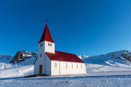 Picturesque aerial view of Vik I Myrdal church on the top of hill in Iceland.の写真素材